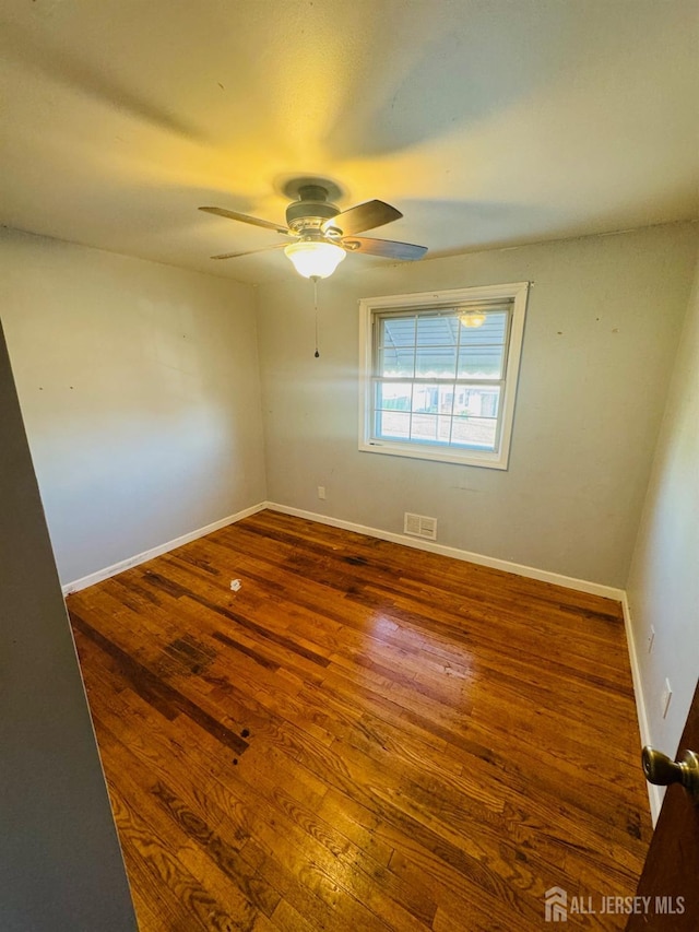 19 Spruce St, Port Reading, NJ 07064 - empty room featuring wood finished floors, ceiling fan, and baseboards