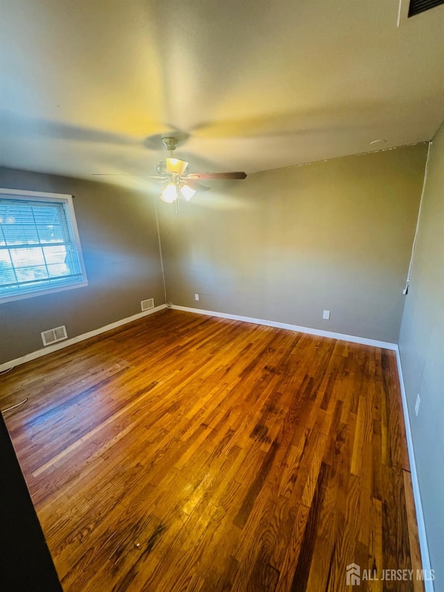 19 Spruce St, Port Reading, NJ 07064 - spare room featuring ceiling fan, wood finished floors, and baseboards