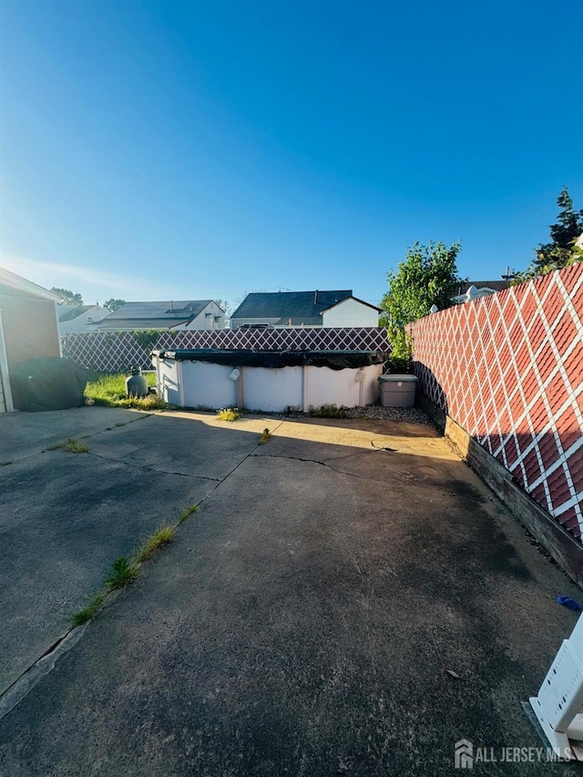 19 Spruce St, Port Reading, NJ 07064 - view of vehicle parking featuring a fenced backyard