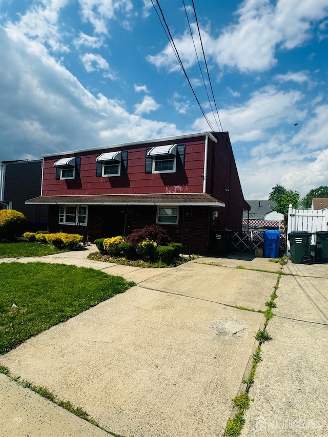19 Spruce St, Port Reading, NJ 07064 - view of front of home featuring concrete driveway and mansard roof