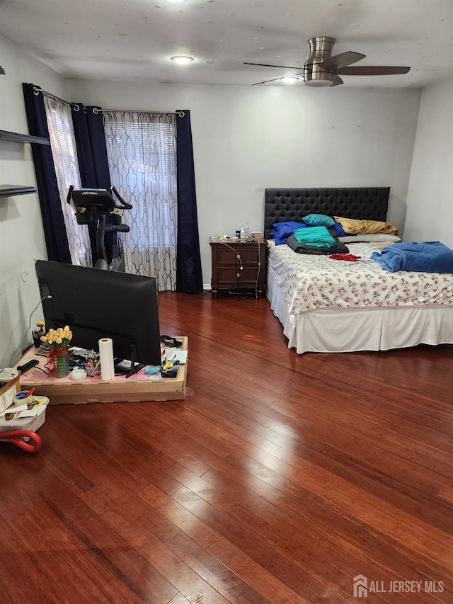 bedroom featuring a ceiling fan and hardwood / wood-style floors