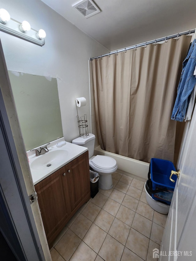 full bath featuring vanity, visible vents, shower / tub combo, tile patterned floors, and toilet