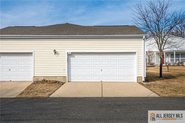 garage featuring driveway