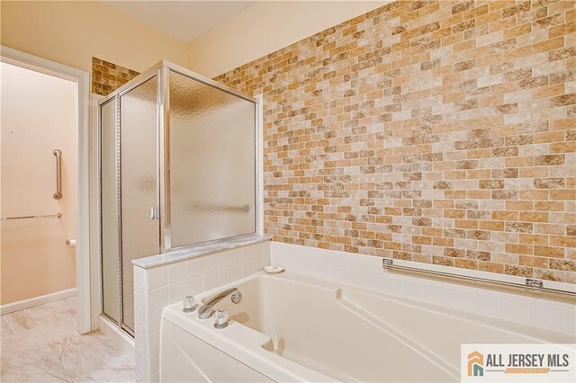 full bath featuring a garden tub and a stall shower