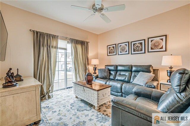 living room featuring a ceiling fan