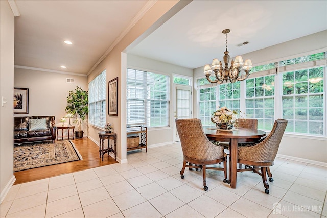 dining area with baseboards, a chandelier, crown molding, light tile patterned floors, and recessed lighting