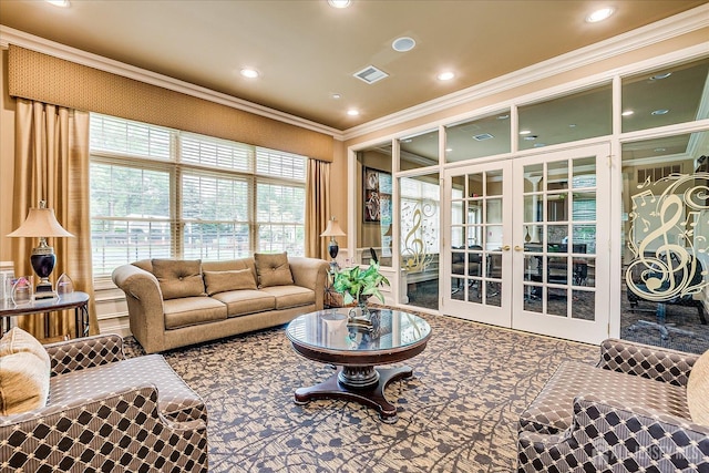 living room with french doors, crown molding, and recessed lighting
