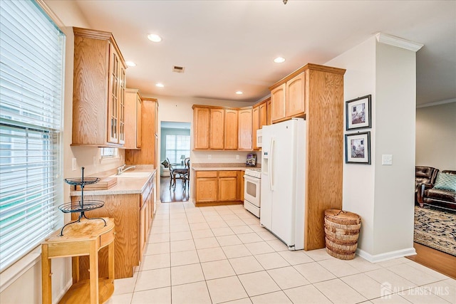 249 Spring Meadow Way, Monroe, NJ 08831 - kitchen with white appliances, light countertops, glass insert cabinets, light brown cabinetry, and light tile patterned floors