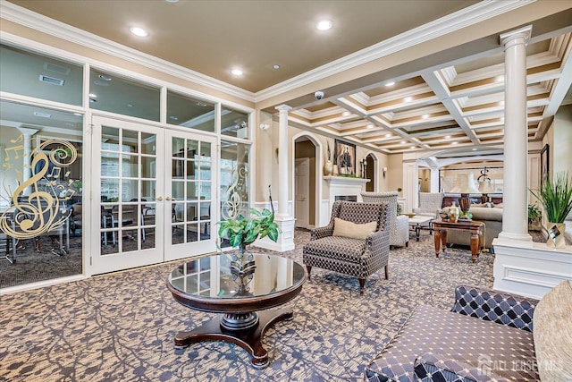 living area with ornate columns, arched walkways, carpet flooring, ornamental molding, and coffered ceiling