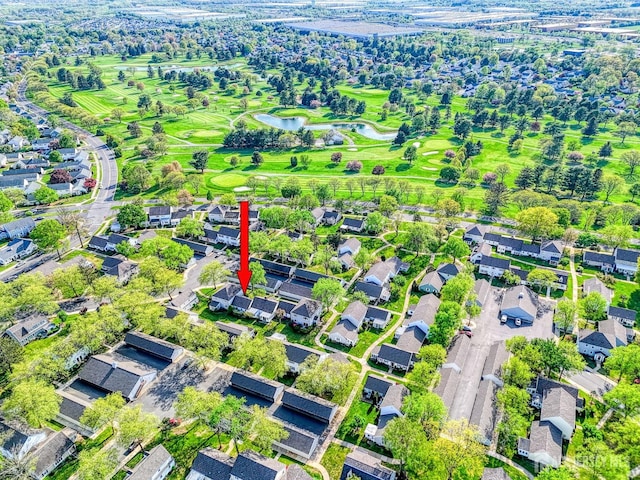 aerial view with a water view, golf course view, and a residential view