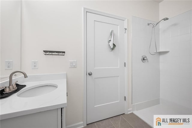 702 Station Rd, Dunellen, NJ 08812 - full bathroom with vanity, a tile shower, tile patterned floors, and baseboards