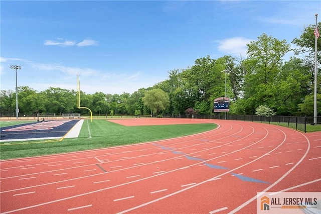 702 Station Rd, Dunellen, NJ 08812 - view of sport court with view of scattered trees and community basketball court