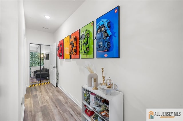 702 Station Rd, Dunellen, NJ 08812 - corridor featuring wood finished floors, baseboards, and recessed lighting
