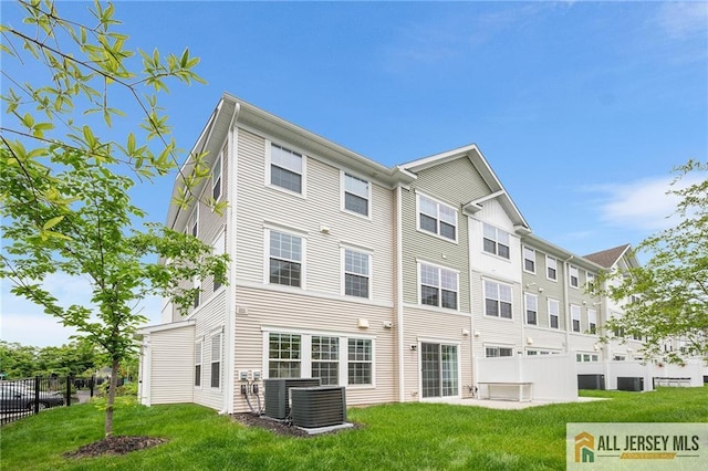702 Station Rd, Dunellen, NJ 08812 - back of house featuring central AC unit