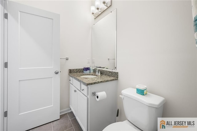 702 Station Rd, Dunellen, NJ 08812 - bathroom featuring vanity, toilet, and tile patterned floors