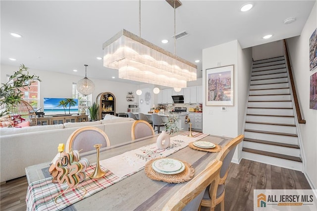 702 Station Rd, Dunellen, NJ 08812 - dining space with wood finished floors, stairway, and recessed lighting