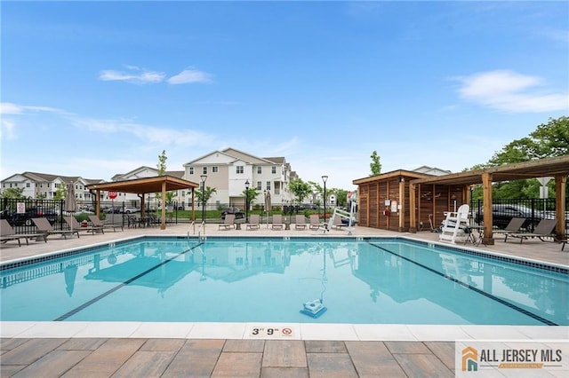 702 Station Rd, Dunellen, NJ 08812 - community pool with a gazebo, a patio area, and a residential view