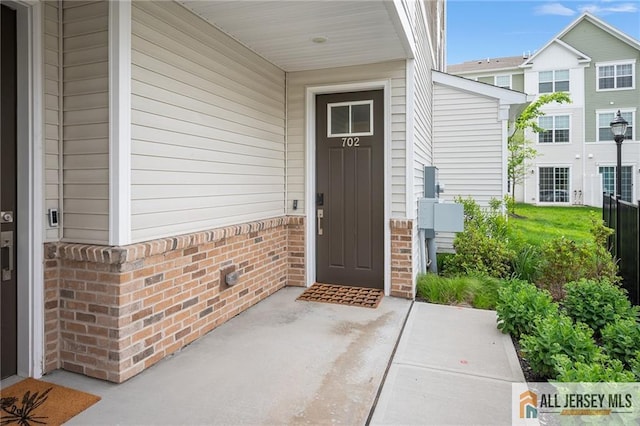 702 Station Rd, Dunellen, NJ 08812 - entrance to property with brick siding and a porch