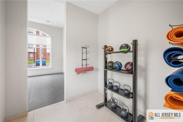 702 Station Rd, Dunellen, NJ 08812 - hall with carpet flooring, baseboards, and tile patterned flooring