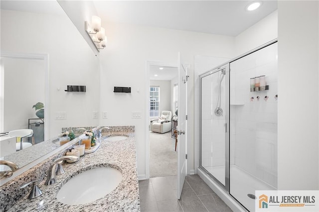 702 Station Rd, Dunellen, NJ 08812 - bathroom with double vanity, a stall shower, tile patterned floors, connected bathroom, and recessed lighting