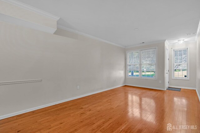 97 Osprey Dr, Old Bridge, NJ 08857 - empty room featuring crown molding and light wood-style floors