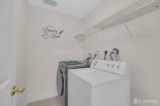 97 Osprey Dr, Old Bridge, NJ 08857 - laundry room featuring separate washer and dryer and light tile patterned floors