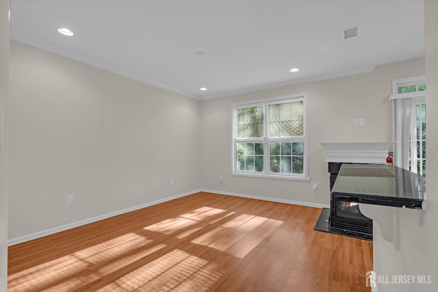 97 Osprey Dr, Old Bridge, NJ 08857 - unfurnished living room with a fireplace with flush hearth, healthy amount of natural light, crown molding, light wood-style flooring, and recessed lighting