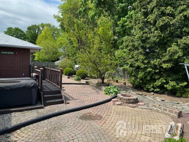 view of patio / terrace with an outdoor fire pit