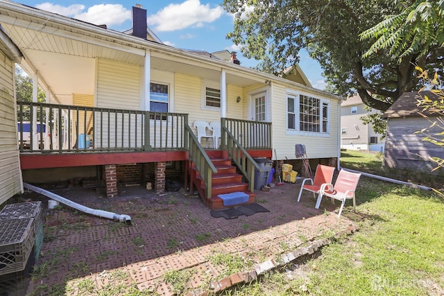 309 1st St, Keyport, NJ 07735 - exterior space with covered porch, a chimney, and a lawn