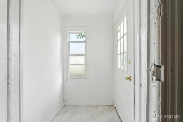 309 1st St, Keyport, NJ 07735 - doorway with baseboards and light marble finish flooring
