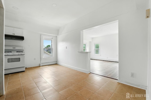 309 1st St, Keyport, NJ 07735 - kitchen featuring gas range gas stove, under cabinet range hood, plenty of natural light, and white cabinets
