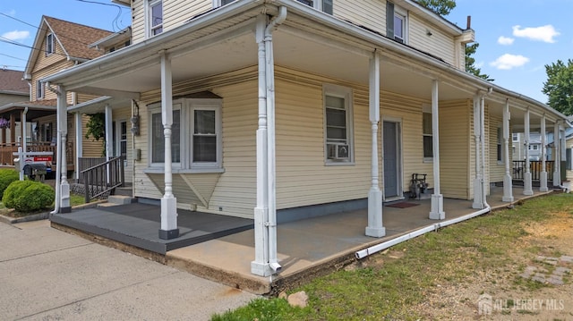 309 1st St, Keyport, NJ 07735 - view of home's exterior with a porch and cooling unit