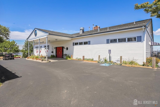 309 1st St, Keyport, NJ 07735 - view of front of house with a chimney and driveway