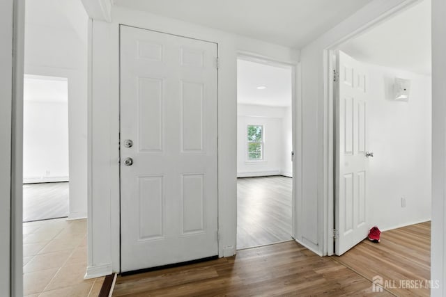 309 1st St, Keyport, NJ 07735 - foyer entrance with wood finished floors and baseboards