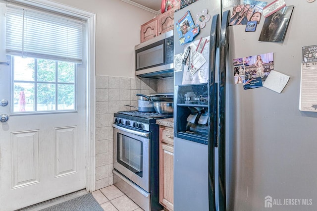 2 Bradley Dr, Edison, NJ 08817 - kitchen with appliances with stainless steel finishes, crown molding, light tile patterned flooring, and light countertops