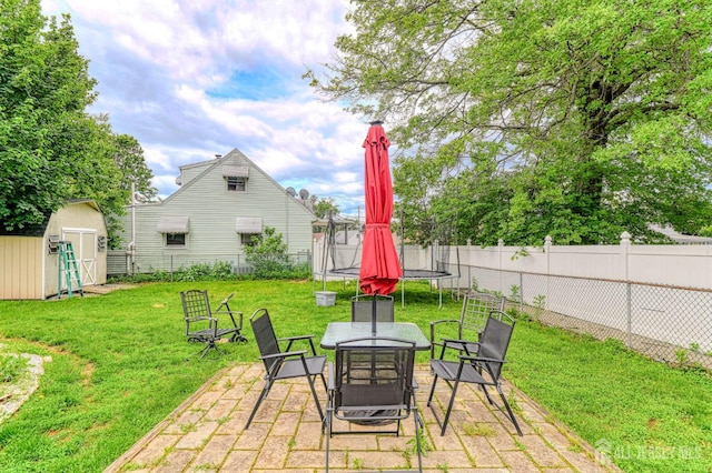 2 Bradley Dr, Edison, NJ 08817 - fenced backyard featuring a trampoline, a shed, and a patio