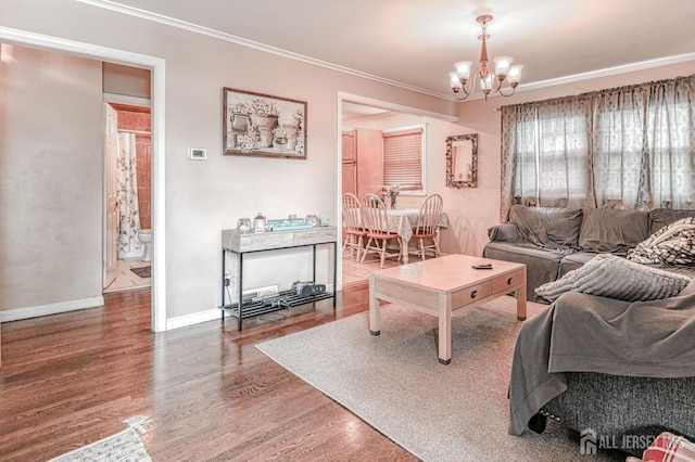 2 Bradley Dr, Edison, NJ 08817 - living room with wood finished floors, a chandelier, and crown molding