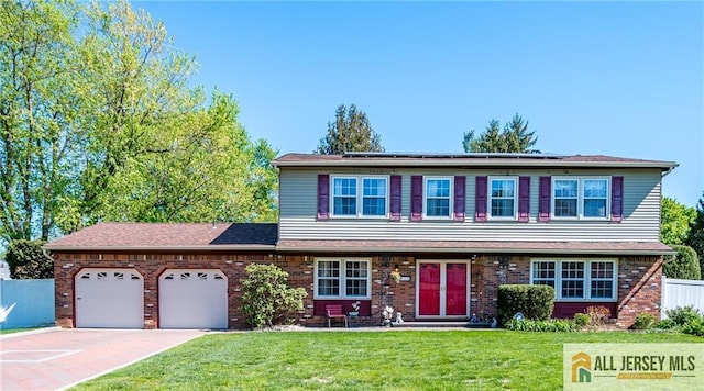 35 Groendyke Ln, Plainsboro, NJ 08536 - view of front of home with an attached garage, roof mounted solar panels, concrete driveway, and brick siding