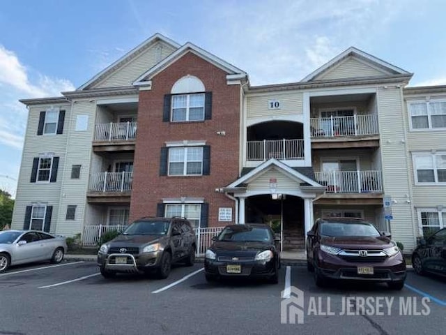 1027 Dogwood Ct, New Brunswick, NJ 08901 - view of property featuring uncovered parking