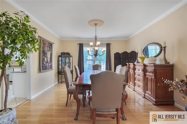 9 Lavender Way E, Brunswick, NJ 08816 - dining space featuring a chandelier, light wood-style floors, and ornamental molding