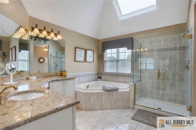 9 Lavender Way E, Brunswick, NJ 08816 - full bathroom featuring a stall shower, a bath, vanity, a skylight, and high vaulted ceiling