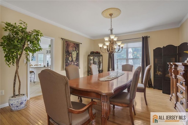 9 Lavender Way E, Brunswick, NJ 08816 - dining room with a chandelier, crown molding, and light wood-style floors