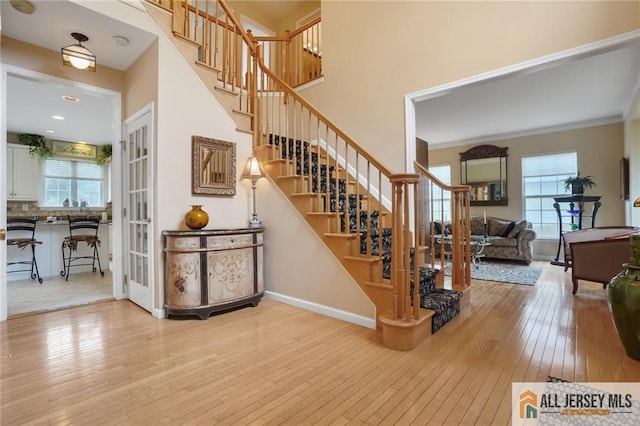9 Lavender Way E, Brunswick, NJ 08816 - staircase with hardwood / wood-style flooring and a towering ceiling