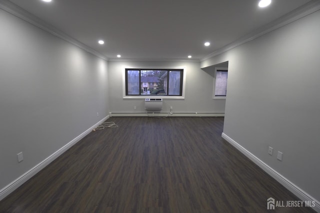 interior space with a wall mounted air conditioner, dark hardwood / wood-style flooring, baseboard heating, and crown molding