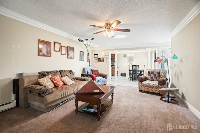 living room with decorative columns, ornamental molding, ceiling fan, baseboard heating, and a textured ceiling