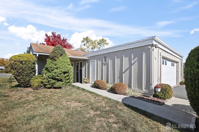 view of property exterior with a garage and a lawn