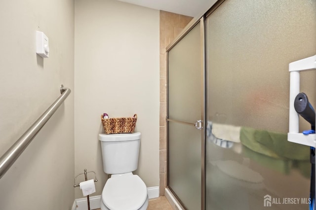 bathroom with walk in shower and toilet