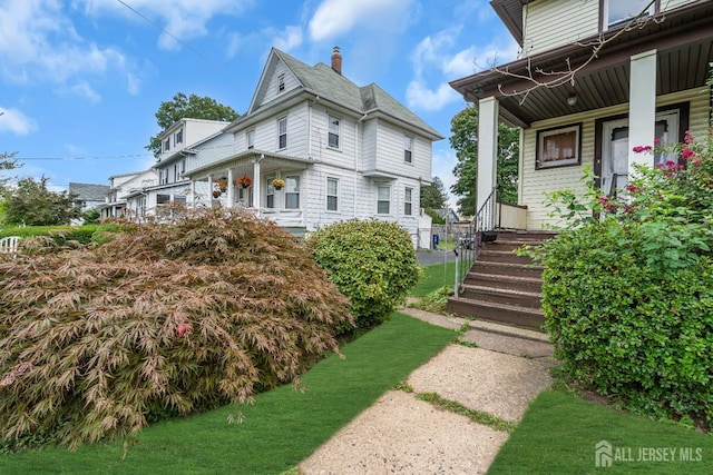 view of home's exterior with a porch