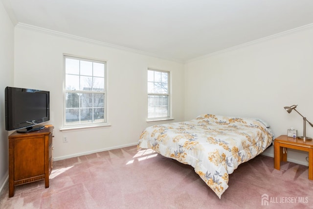 bedroom featuring crown molding, baseboards, and light colored carpet