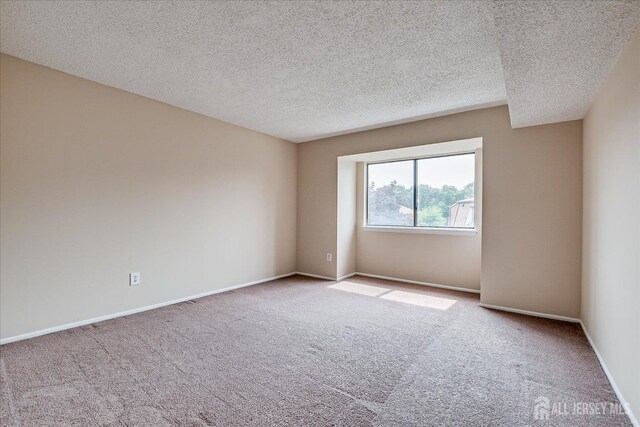 223 Edison Glen Ter, Edison, NJ 08837 - carpeted empty room featuring a textured ceiling